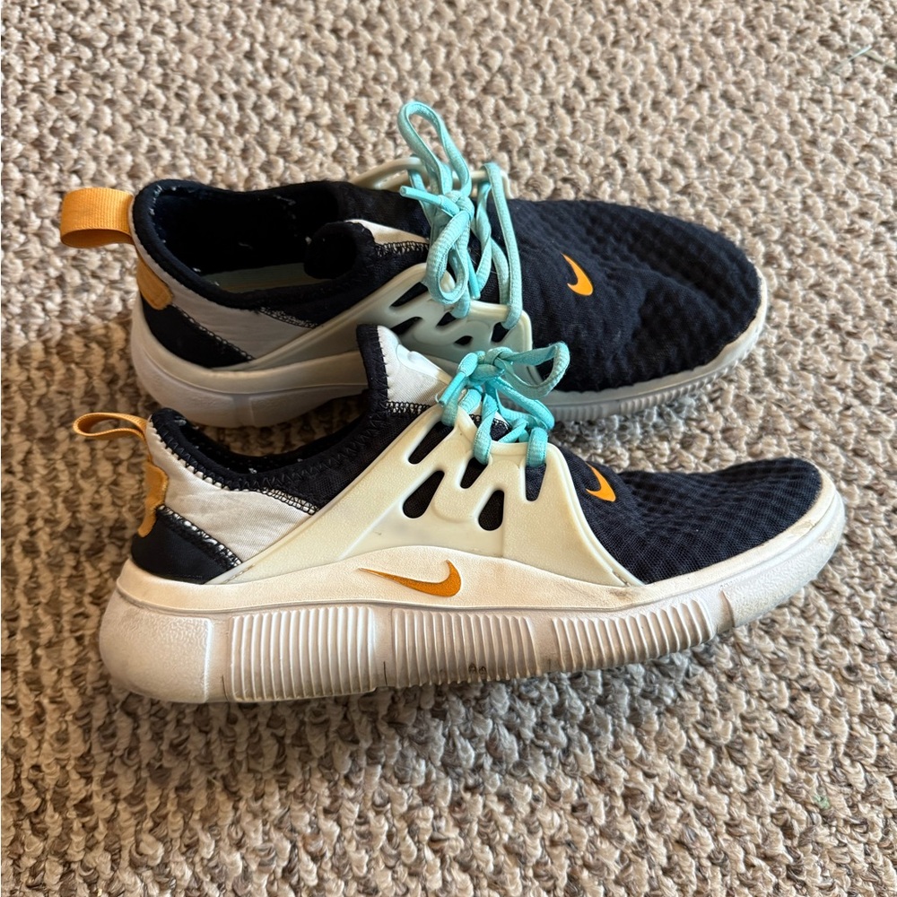 Nike Black Athletic Shoes with White Cage and Teal Laces